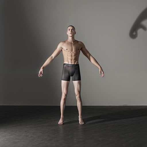 Aphrite Pose Studio Generated Image of a nude man taking a default pose in studio lighting